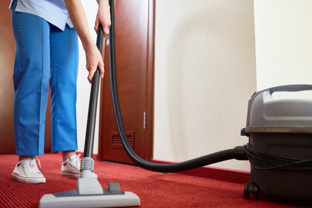 Cleaning carpet in hotel room